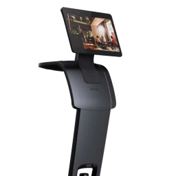 Interactive standing kiosk with a mounted touchscreen tablet on a curved pedestal showing a photo on the screen.