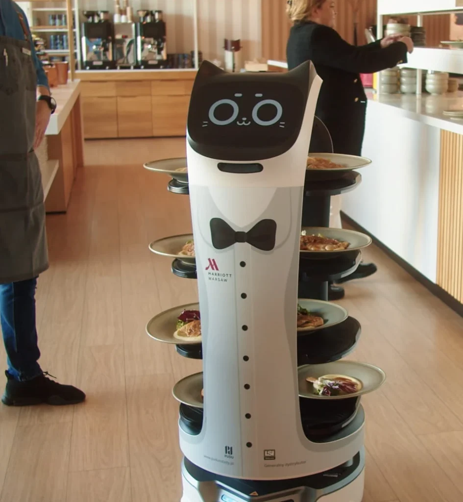 A Bellabot Pro robot delivering food in a cafe.