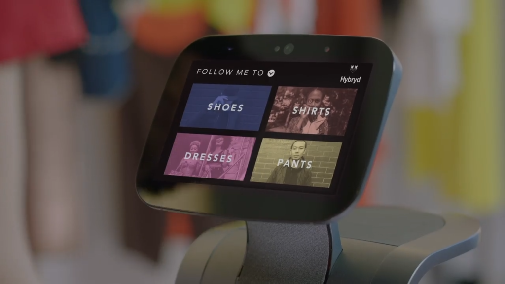 A temi providing a wayfinding service for customers, with four destinations available on the touchscreen: 'shoes', 'shirts', 'dresses', and 'pants'.